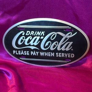 Black and silver Coca-Cola tin sign/licence plate